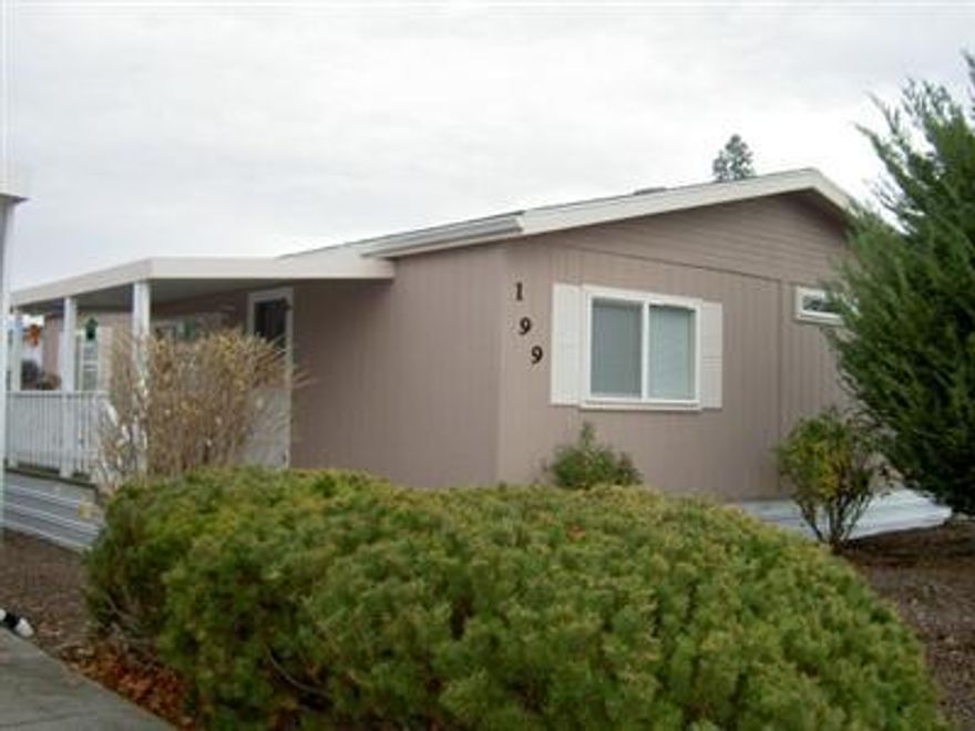 Very nice clean home in an excellent mobile home park. 2 bdrm 2 ba plus a den, utility, vaulted ceilings throughout, plenty of cabinets, storage shed, carport, cyclone fenced, a covered deck, carport, shrubs have drip system. Everything is easy maintenance. Rent will be $345 to new owner. Well worth showing.