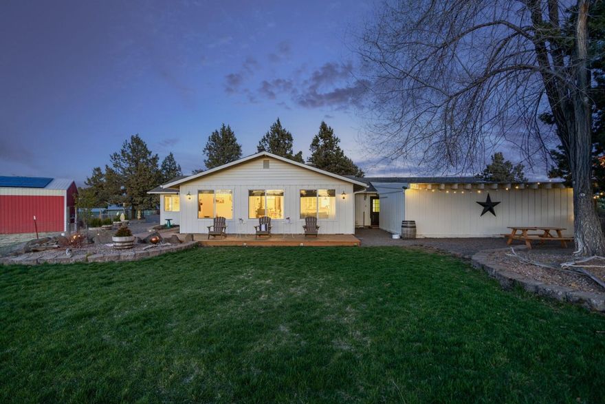 Welcome to this well-kept 3-acre hobby farm on Bend's eastside. You'll enjoy the quiet country setting, yet still be close to the amenities of town. With 2 irrigated acres, deer-proof garden, chicken coop and a large barn, this property provides many sustainability options. Furry and feathered farm friends are welcome here! Come say ''hi'' to the current inhabitants: 6 goats, 5 ducks and 2 geese. Property is fully fenced. The main home is a single level charmer with 4 bedroom, 3 full baths and lots of natural light. There is a small office with exterior door currently used for home business. This property also offers multigenerational living opportunities. Outdoor living space on 3 sides of the house, perfect for enjoying the outdoors with family and friends. So much love has been put into this property!