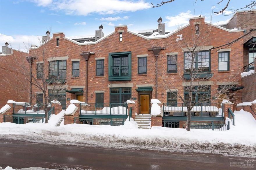 Live the urban life in Bend from this brownstone townhouse in desirable Mill Quarter near the Old Mill District and Box Factory. Appreciate easterly and westerly views including Cascade Mountain views from the rooftop deck on this triple-level townhouse. Inside, you'll find wood floors, open ceilings, and tile finishes throughout. On the main level, enjoy a spacious great room, dining area, and kitchen complete with Viking stainless steel appliances. The master suite includes a tiled shower, soaking tub, and walk-in closet with built-ins. Downstairs, the separate guest suite features its own private entrance and Murphy bed. This townhouse also features a two car garage and an elevator for easy access between levels.
