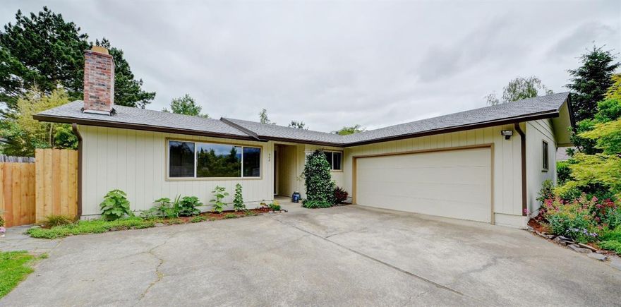 Don't miss this great home w/a wonderful large rear yard with mature landscaping and many fruit trees. Abundance of updates over the past two years make this single level home in a quiet neighborhood a great choice.  Updates include Bamboo flooring, carpeting, appliances, paint, lighting, HVAC system and ducting, hot water heater and more. Lovely touches throughout include spacious living room with wood burning fireplace with brick mantle and surround. Open dining room and kitchen with  tile backsplash and counters & glass top range. Slider from dining room allows nice natural light throughout main living areas and opens to the patio and huge rear yard. Master is spacious and has dual closets and slider to patio. 2 additional bedrooms and total 2 baths with nice tile work. The yard is stunning with expansive lawn area, planter beds, peach, cherry, pear, apple & plum trees, arbor with shaded sitting area, mature shade trees, evergreens & mountain views in the distance. Double garage.