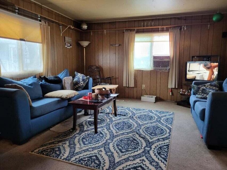Older, cozy, 1973, 2bd, 1ba mobile located in a clean, quiet, senior park in Medford. Wrap around yard just'' big enough'' and close to mall and medical.