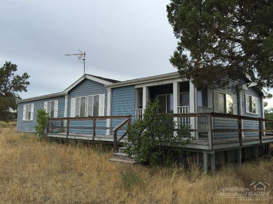 3 bedroom, 2 bath home on 5 acres. 2 car garage with attached bonus room...could be great shop. Livestock is acceptable, property is fenced with private gates. Property is being sold AS IS