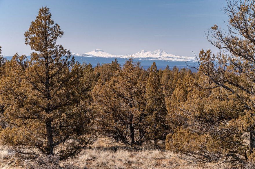 Breathtaking mountain views on a private 10 acre Powell Butte property.  Approved building site and standard septic feasibility in place with underground power at the property line.  With a circular driveway and level RV pad, this property is ready for your dream home without the restrictions of CCR's or HOA!