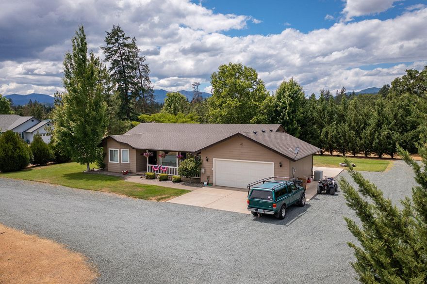 Welcome to Green Acres!  This well cared for home is in a quiet neighborhood on a dead end road and is situated on 1.42 fully fenced acres with 3 bedrooms, 2 full baths, and a bonus room off the living space.  New roof in 2019. Enjoy the home's modern amenities including vaulted ceilings, stone countertops, hardwood flooring and a light, bright living space.  The property is well landscaped with a large lawn and concrete patio, perfect for entertaining.  The expansive parking space allows for parking of multiple vehicles, RV, equipment, or toys!