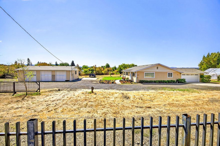 Country Living Close to Town! This unique property offers 1.28 usable fully fenced acres with beautiful Table Rock views, well-maintained 3 bed 2 bath 1632 sf home, 24' x 40' detached 3 bay shop with 220V and dedicated 200Amp panel, and large 20' x 32' greenhouse complete with composter.  Enjoy lots of light and open living inside the home, including updated kitchen with new countertops and quality appliances, LVP flooring, versatile laundry/mudroom, and primary that leads out to the spacious backyard and gazebo. Additional features are new roofs on home and shop in 2021, 10gpm well per seller, city sewer, RV hookups with sewer dump, natural gas hook up on site, security gates, and plenty of parking and room for your toys! Don't miss out on this rare opportunity!