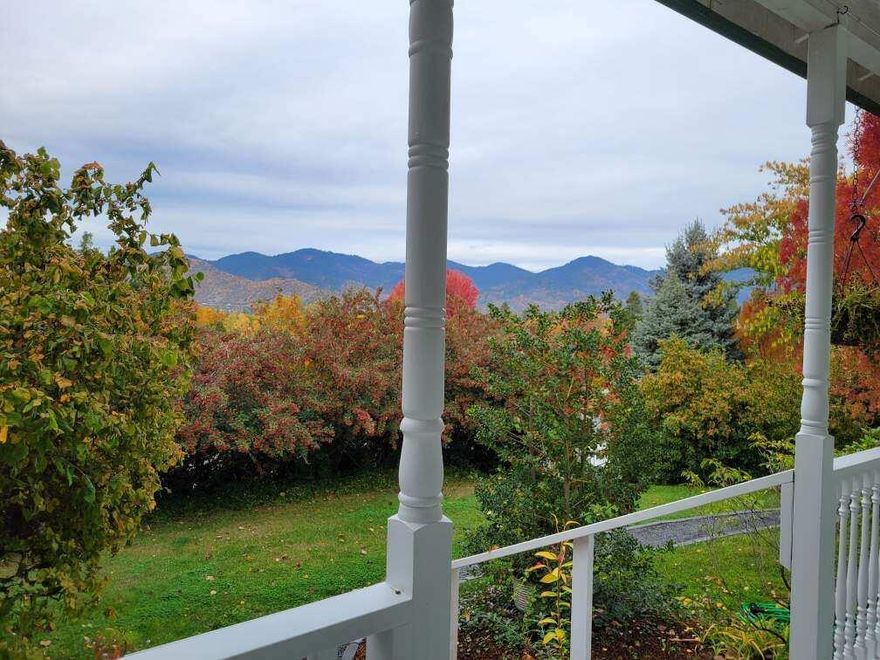 Beautifully remodeled with modern features, soaring ceilings and expansive windows offering stellar views. The entire upstairs is a primary suite w/a large bathroom & walk in closet, plumbed to add a kitchenette if you want a separate apartment for possible ADU. It has its own balcony (ready for a hot tub) with amazing views & its own entrance. There's also a primary downstairs. A small part of the original home remains with charming tongue and groove paneling. This is a gardener's delight with a vegetable garden that's deer fenced, raised beds and organic soil that produces plenty! There's also a well-built garden shed & chicken coop surrounded by numerous fruit trees, plantings, grapes, raspberries and flowers for all seasons  Sitting slightly above street level, the entire setting feels very private & secluded. The lot has many mature evergreens & deciduous trees. All located close to the hospital & shopping.