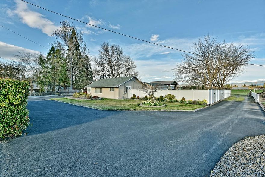 What an amazing home in an amazing location. Nicely updated 3 bed 2 bath home on .99 acres fully irrigated. The home features a split floor plan. Outside is a heated & air conditioned shop that is 24X36 sqft. There are 2 outdoor storage sheds as well as covered RV parking w/hookups. Close proximity to Jacksonville. Perfect for 4-H or a small farm set-up