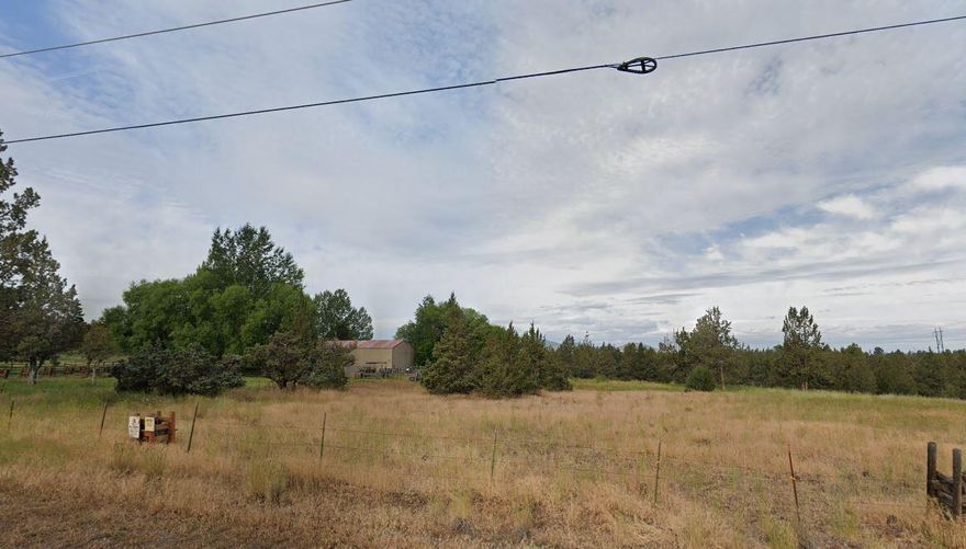 This incredible property is two parcels being sold as a package. The parcel with the home is 5.23 acres and the other parcel is 9.45 acres. The possibilities are endless here! The home has 3 bedrooms and 2 full bathrooms and a bonus room. 
A beautiful covered porch to relax and enjoy the landscape and 2 greenhouse/sunrooms one off the kitchen and one off the primary bedroom. Detached one car garage with sauna, 30 x 50 shop with work shop inside. 4 acres of the property is irrigated. Beautiful views of the cascade mountains this property truly is unique.