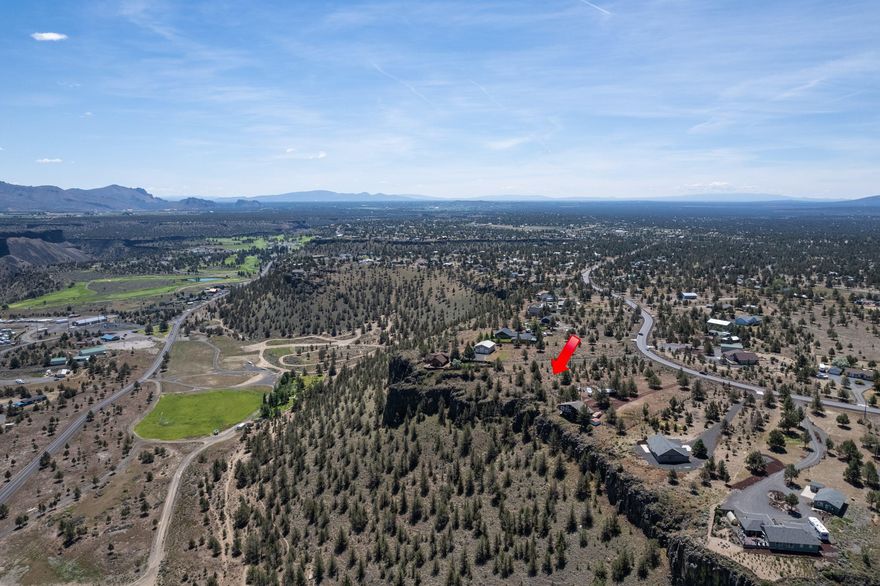 Rare small acreage rim lot! This spacious 1.64 acre parcel opens up toward the back of the lot, offering the perfect homesite. Gaze over soaring eagles across the vast canyon at Mt Hood and Juniper Butte from your back deck of your dream home. Enjoy Cascade Mountain Views to the west from the front deck, first story, or be swept away by panoramic views from a second story home. Long driveway and surprisingly dense juniper growth offers a privacy that is hard to find on 1.6+ acres. Power at the lot line, water at the street, septic approved for Cap N Fill! Enjoy easy access to the golf course, pool, river, restaurants, and riding/hiking trails while being only 15 miles to Redmond! This is your chance to secure your dream rim property in the coveted Crooked River Ranch community!