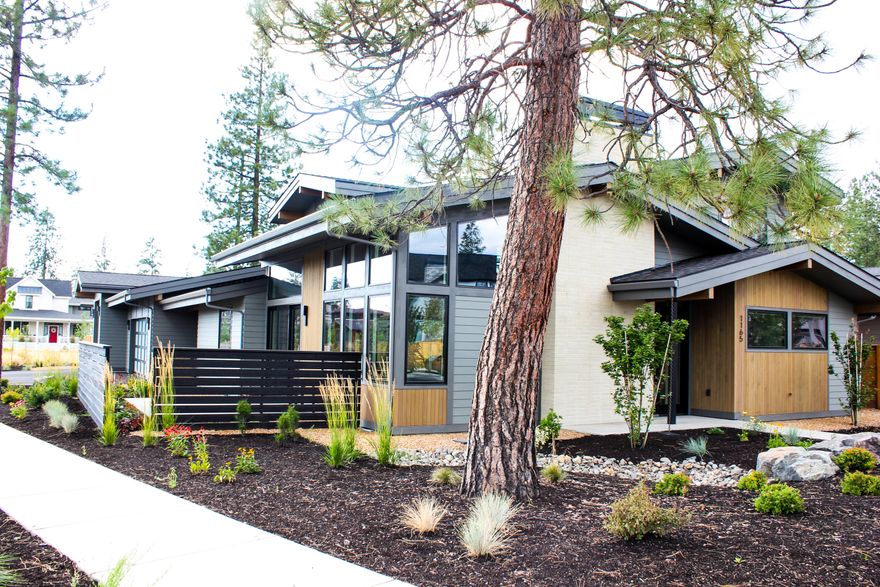 Welcome to this exquisite Mid-Century Modern home designed by local architect Jason Todd & crafted by renowned builder, Michael Wilkins. 
Situated on one of the larger lots in DW and backing up to open space, this home offers direct access to neighborhood trails and is within walking distance to Elementary, Middle, and High Schools.  It features an open concept design, high ceilings, and wood-wrapped Pella windows. The quality is unparalleled with sand-in-place hardwood floors, slab quartz countertops, high-end Thermador appliances, heated master bathroom floors and automated blinds. Truly setting it apart is its massive 3-car garage with Sprinter bay containing pull-through access to the large, flat backyard. Outdoor living is a dream with a gas fire pit, new Arctic hot tub, in-ground trampoline and irrigated garden beds. Constructed with Michael Wilkins' attention to detail and using the highest quality materials, this home is a true gem in West Bend!