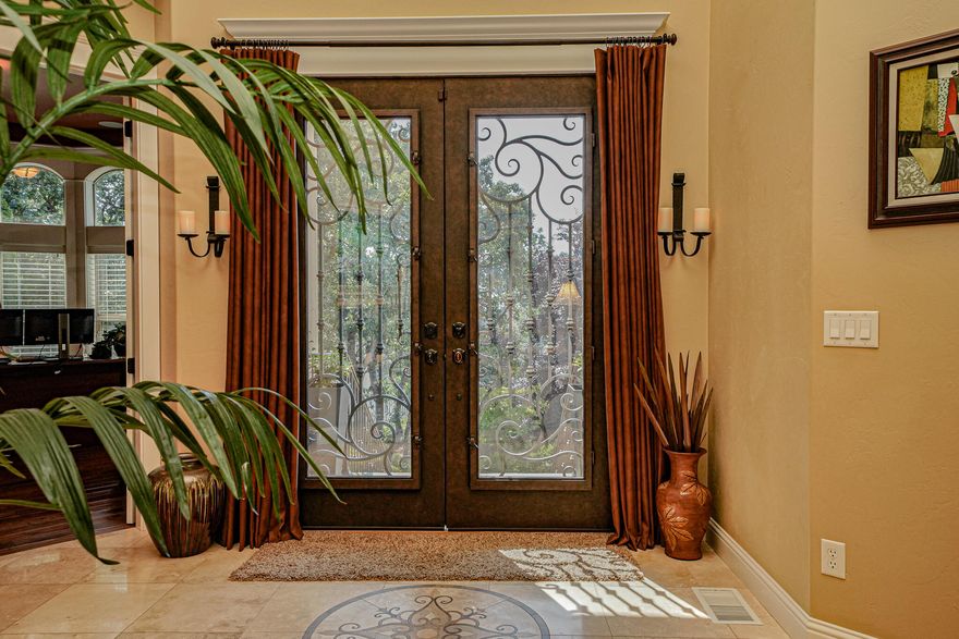 Exquisite custom home on .43 acre lot. The outdoor oasis features a Pebbletech pool with 5 color LED lights and waterfall. Additionally there is an outdoor fireplace and stunning covered patio. This elegant home boasts soaring 20' ceilings, travertine tile with medallion flooring, hand-scraped walnut floors, gorgeous formal dining area, designer ceiling fans, custom drapery and gas fireplace in the great room. Entertainer's kitchen has granite counters, knotty alder cabinets, dbl oven & warming drawer, 6 burner gas cooktop w/retractable hood and large walk-in pantry. Main-level master suite features a fireplace, soaking tub, built-ins and large walk-in closet. This 3235 sf., 4bed/3.5bth home, built in 2008 with 3-car finished garage is a masterpiece.