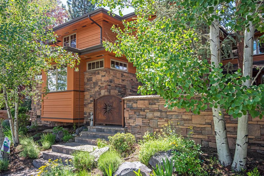 This Frank Lloyd Wright style and quality Gary Norman built home offers stone and paver gated entrance to the private courtyard with stately Pine tree.  Once inside your new castle that offers a main level master with reclaimed barn wood floors and a master bath with radiant heated tile floor, BainUltra soaking tub, spacious walk-in shower, dual vanity sinks, water closet, and walk-in closet.  The great room offers Chef's kitchen, with stone tile counters, solid surface eating bar, coffered dining area, stone surround gas fireplace and large living room finished in reclaimed barn wood. Upstairs offers built-in bookcases, storage chests, 3 large bedrooms, and a full bathroom.  What a pleasure to be able to offer this rare opportunity in NorthWest Crossing.  Private location on the corner of High Lakes Loop and Meriwether Place with convenient alley access garage.