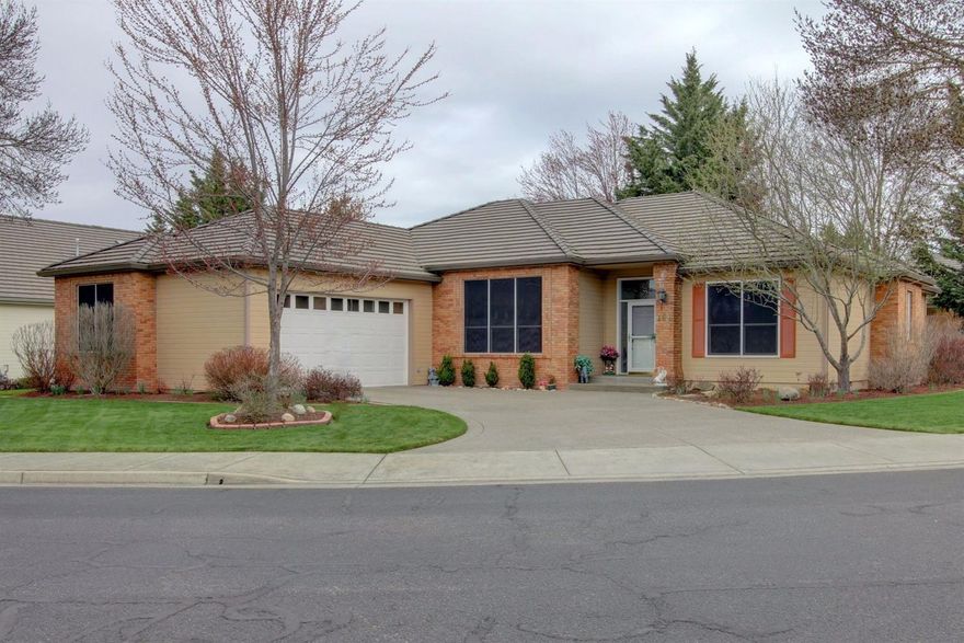 This lovely Eagle Point Golf Course home is located in the desirable Fairway Ridge Estates and minutes away from the clubhouse and golf driving range. Highly sought after split floor plan, high ceilings thru-out, gas fireplace, light and bright with lots of natural light. Beautiful kitchen with stainless, granite, and large skylight, opens to the spacious great room and large formal dining area, perfect for entertaining. Master suite is beautiful with large master bath, soaking tub, double vanity, shower and walk in closet. Situated on a large corner lot, you will enjoy this homes beautifully manicured lawn and landscaping, covered patio with ceiling fan. Lovingly maintained. Huge utility room, lots of cabinets and storage thru-out.