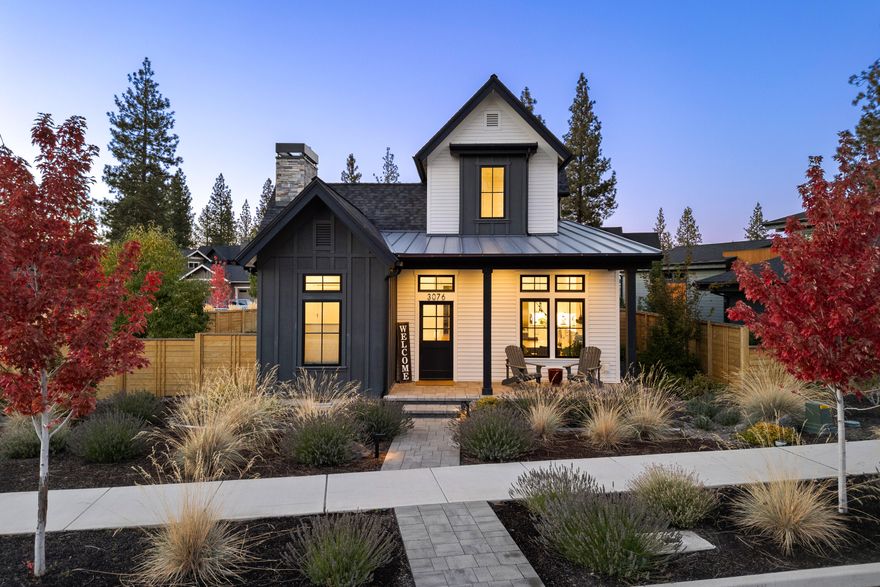 This stunning 3-bedroom, 2.5-bath modern farmhouse situated on a corner lot offers an open floor plan with main-floor office, the ideal work space. Custom lighting is featured throughout the home, highlighting the large kitchen island with bar seating—perfect for casual meals or entertaining guests. The kitchen is equipped with premium Thermador appliances, including a separate ''snack'' refrigerator for added convenience. The primary suite is located downstairs & boasts vaulted ceilings with custom wood beams, providing a luxurious retreat. Upstairs two bedrooms & a full bath offer the ideal separation of space. Step outside to the private courtyard, where you'll find a custom firepit, a sunken hot tub, & a grassy area ideal for relaxation or gatherings. The oversized two-car garage has plenty of room for storage & toys. Located in the coveted Discovery West neighborhood, close to schools, trails, & shopping, making it a perfect blend of comfort, style, & convenience.