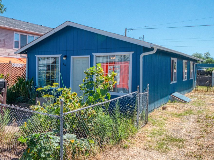 Seller to credit $5,000 towards buyer's closing costs. Home qualifies for Oregon Bond Rate Advantage program with a 4.5% interest rate for qualified Conventional, VA or FHA buyers. This 3-Bedroom/1-Bathroom cottage style home has been remodeled with new paint, new flooring, new roof, and new ductwork—all of which make this property move-in ready. It even includes a fridge, washer, dryer, standup freezer and 2 flat panel TV's! The  fenced yard is spacious enough for pets or kids and the ample garden out front is stocked. At less than 1500 feet from McLoughlin Middle School and with fantastic proximity to restaurants, shopping and medical this house is ready to become home!