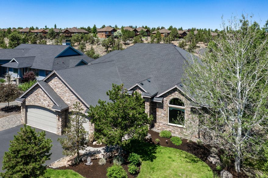 Retreat to the comfortable lifestyle at Eagle Crest Resort!  This entertainers cutom home, offers approximately 4064 sqft of living space...majority of which is on the main level!  
Soaring vaults & walls of windows provide ample light throughout the primary living spaces. Gourmet kitchen features granite countertops, slate flooring, huge island w/gas range, stainless steel appliances, shaker cabinets & walk-in pantry.
Elegant master suite on the main, offers gas fireplace, soaking tub, walk-in shower, dual sinks, walk-in closet & access to the back deck.  Two additional guest rooms, 2 full & 2 half baths, an office, & bonus room...round out the living spaces.  Wonderfull back deck provides a tranquil place to sit and enjoy the peace Eagle Crest has to offer!  The resort offers plenty of opportunity to satisfy the active lifestyle...w/miles of biking & walking paths, tennis & pickle ball courts, multiple golf courses, pool and a sports center...there's always plenty to do!