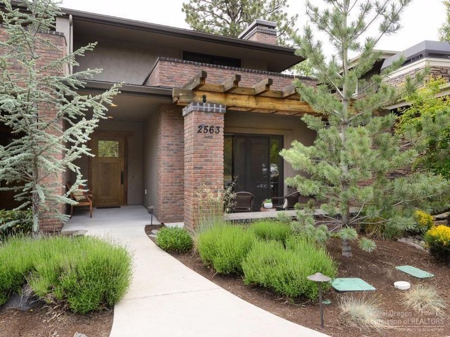 Elegant NW Contemporary townhome in NW Crossing! Live and play just blocks from dining, shopping, parks, trails, and schools. 2943 SF of high end craftsmanship. Reclaimed wood floors, commercial stainless kitchen, large living spaces. Three elegant bedrooms all en suite, offer private paver patios. Loft, flex space for home office or workout area. Oversized two car garage. Outdoor patio with built in gas BBQ for entertaining. Situated across from Compass Park! Lifestyle living in Bend!