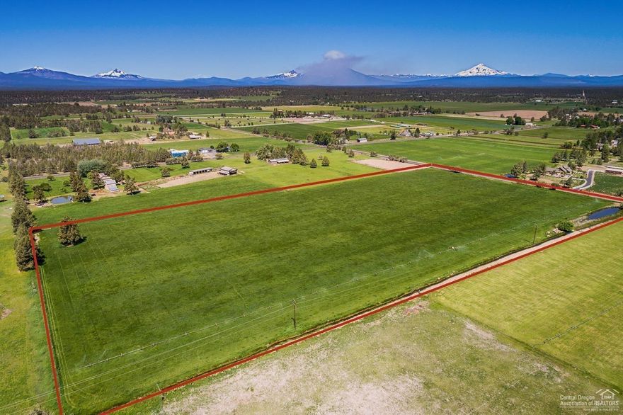 This is a unique opportunity to purchase nearly 10 acres which includes approx. 8 acres of sought after Tumalo irrigation. Adjacent parcel is also available for sale. Scenic Tumalo is like a step back in time with today's amenities including a coffee shop, festive eatery, food truck and tap house, firehouse and historic grade school in addition to the private Cascade Academy pre K through 12. Just what you would expect in a rural farm community!