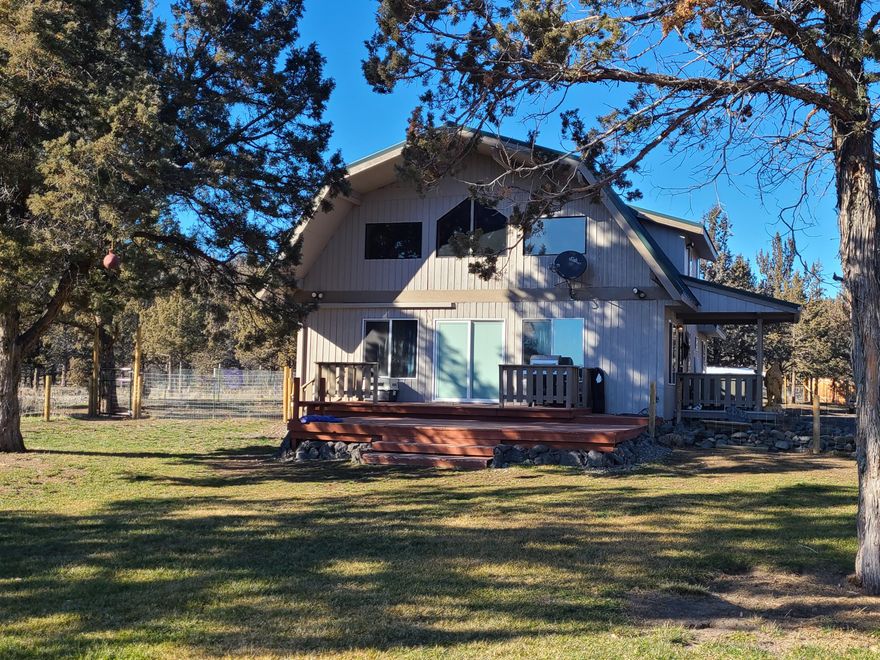 Custom Lindall Cedar Home on 5.1 acres, in a peaceful, serene setting near the reservoir.  What an amazing property!  Level, fenced 5.1 acres with pastures, seasonal creeks and a perfect blend of trees and clearings, great views of the surrounding hills with supreme privacy.  Multiple decks, spacious open great room design, with extensive remodeling throughout...  tankless water heater, ductless mini-splits heat pump, new kitchen, newer flooring, newer lighting, newer windows, large bedrooms, newer counters and cabinetry, newer appliances, freshly stained decks, newer fencing, newer detached shop, large chicken coop, greenhouse and storage building.  This is a truly magical, peaceful property ready to connect with you!  One year home warranty included.