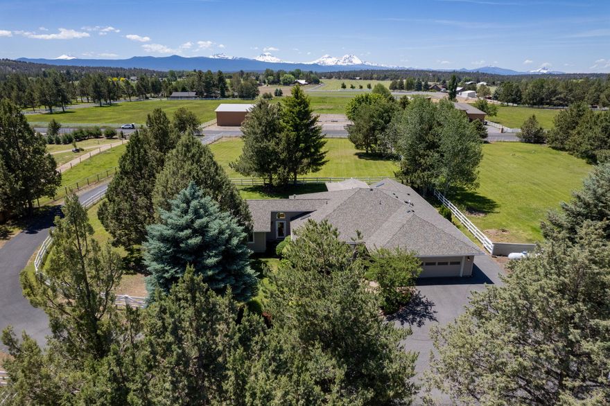 Impeccably maintained 5 Acre Property with turn key single level living. This Freshly Renovated Home just minutes from the Deschutes River and Downtown Tumalo! This Home offers Spectacular Cascade Mountain Views, Two Primary En-suite Bedrooms, a Guest Bedroom & Full Bath, an Office, Two Living Spaces & a Light-Filled Kitchen & Dining area perfect for Entertaining. The Shop/Barn offers Multiple Flex Spaces to create endless opportunities for Horses, Storage or keep the Home Gym and Office setup. Enjoy the Convenience of Avion Water for your domestic use! 3 Acres of Tumalo Irrigation all with Underground Sprinklers, White Vinyl Fencing and a Gated Entrance makes this a perfect Escape for anyone looking for Privacy and Space within Bend!