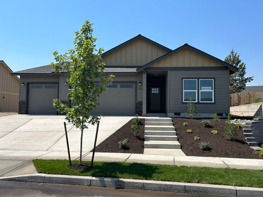 Welcome to Korbin Meadows, Phase 1, a new community in desirable neighborhood of SW Redmond. Lot 5 features the Summit floorplan, a NW / Craftsman design w/ single level living, 3 bdrms, 2 1/2 baths, den/office, utility/laundry room & 3 car garage. Extensive separation between primary bdrm (w/ walk-in closet & 2 vanities) and 2 guest bedrooms w/full bath. Entertain in your kitchen w/ SS appliances, full height tiled backsplash, extensive slab quartz countertops opening to dining area & great room w/ decorative gas burning fireplace & peek-a-boo Cascade Mtn views. Designer contemporary lighting package. Durable laminate plank flooring thru-out w/ carpeted bdrms & tiled primary bathroom. Fenced & landscaped backyard w/ sprinklers, covered patio. Upgraded finishes & A/C included! Est. completion early September 2023.*Rendering/floorplan subject to change. Photos for reference only, finishes may vary.