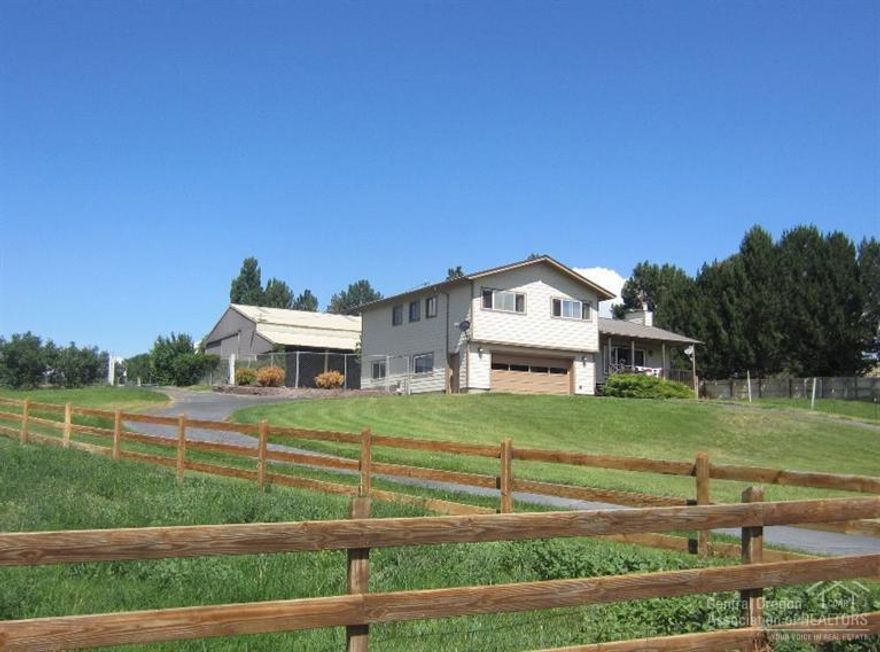 Take a short drive to the country to view this wonderful home, with nice Easterly views! Room for the family, animals & toys this home & property have it all. Over-sized master suite, pellet stove insert, tile flooring, fenced backyard, 2 pastures, private well, heat pump, garden area, RV area, RV hook-ups, chicken coop, large shop w/1/2 bath has 15' over hang on two sides. It is a must see call for your private showing today!