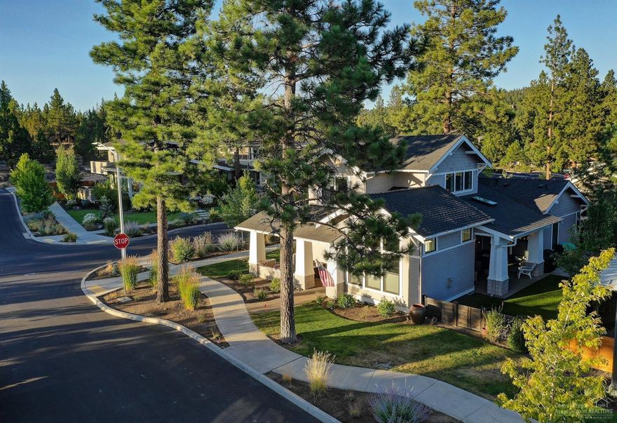 This meticulously kept 2014 Tour of Homes winner near Discovery park has it all and feels like brand new! High ceilings in every room + beautiful finishes with master on main and two bedrooms + large bonus/loft with bar area upstairs! The open kitchen features antiqued granite counters, huge pantry, soft touch drawers (throughout entire home)and looks out to living room with fireplace, dining room with built-in buffet and double sliding doors out to the covered patio with lighting, fan, and television - perfect for entertaining year round. You will love the Pottery Barn fixtures, dual opening cordless blinds, triple pane windows, private corner lot, exquisite hardwoods, modern bathrooms with corner cabinetry and high vanities, radiant master bath marble floors not to mention surround sound speakers through home and outdoor area. Exterior is beautifully landscaped with fenced, turf and grass yard and pavers plus a wrap around front porch!