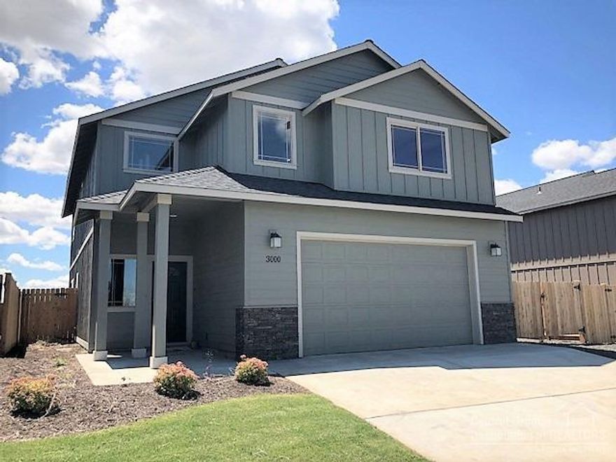 The Laurel floor plan in one of Redmond's premier neighborhoods. 4 bedroom, 2.5 bath, 2,415 sf of living space. Large great room w/fireplace open to dining & kitchen w/eating bar. Modern white cabinet package, Quartz slab counter tops, laminate floors on main floor, all Stainless Energy Star appliances. Gas forced air w/high efficiency furnace & A/C pre wire. Triple, tandem garage. Front landscaping w/auto sprinklers, fully fenced. Model home @ 3095 NW Alder Place. Open Thurs-Mon 12-5pm