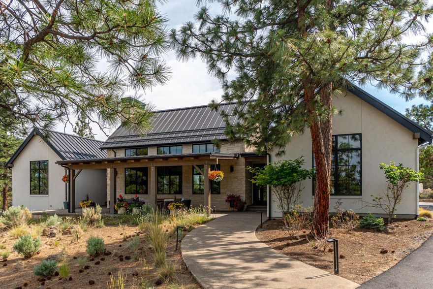 Exquisite Contemporary Farmhouse / Texas Hill-Country style home in the gated community of North Rim.  Situated at the end of a cul-de-sac on a 1.56 acre lot, this exceptional single-level residence greets you with an elevated ceiling, open concept great room and large windows capturing the natural light.  This 4 Bedroom 2 ½ bath home showcases extensive high-end updating including the custom gourmet kitchen, walnut doors & cabinetry, smart lighting, home audio, etc.  Primary suite is situated in a private wing with an elegant soaking tub and walk-in shower.  The stone facade and large inviting covered front porch welcome you like an old friend.  Huge 1,123 sqft oversized 3-car heated garage with built-in fridge.  Enjoy the blend of elegance and nature in the coveted neighborhood of North Rim on Awbrey Butte.