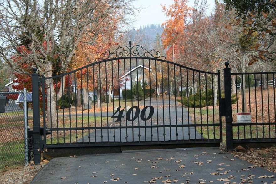 This is a really nice home in the very desirable Colonial Valley. It has 3 bedrooms and 3 bathrooms. There is a master bedroom on each end of the home. It has 2442 sq. ft. of living space. It has a nice living room, with a gas stove and a family room also and both have oak flooring. The living room has nice wood ceiling. There is a 2 car attached garage and in the back yard a 3 car garage/shop and a carport on the side. Nice open land with lots of sun. When you view the property, the first fence you come to in the back yard is not the property line, it is the next fence you come to, nice sized lot at 3.54 acres. All information deemed accurate but is subject to change.