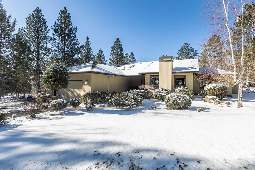 Beautiful single level home on Awbrey Butte is warm and inviting. Open great room plan features built-ins and a cozy gas fireplace, spacious kitchen with breakfast bar, and generous dining area. Large windows throughout bring in the natural light and wood floors, trimmed windows and french doors add handsome finishing touches. The master suite offers a second gas fireplace and separate deck, bath with double vanity, jetted soaking tub and separate shower. Two additional bedrooms (one currently used as an office), guest bath with tiled shower and laundry room with ample storage complete the home. A fenced courtyard patio is perfect for relaxing and entertaining. Mature landscaping and stately Ponderosa pines provide a wonderful setting to enjoy the abundant wildlife. Oversized double garage. Located  on a .54 acre lot, kitty corner from park and tennis courts. Seller is a licensed broker in the State of Oregon.