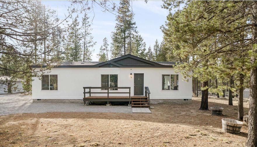 Beautifully updated 3-Bedroom, 2-Bath Home on 1.2 Acres! Surrounded by pines, sunny skies, and privacy, this property is truly special- just minutes from Hwy 97 and La Pine. Built in 2019, the home is like new and features brand new upgrades including interior paint, fixtures, and flooring throughout, creating a bright, clean, and inviting feel. Enjoy an open floor plan with a large kitchen, center island, and dining area filled with natural light.
Outside, you'll find an 18x36 shop with attached storage rooms- perfect for projects, hobbies, or storing toys and gear. There's also a 10x12 shed, a picnic area with a BBQ and fire pit, and a fun tree fort for the kids! The home and shed exteriors have also been freshly painted.
Connected to city sewer and water, plus a well. This property is ideal for gardening, a mini-farm, and offers plenty of parking space- including room for an RV. It is fully fenced and gated, and the home is move-in ready. A must-see, this home won't last long!