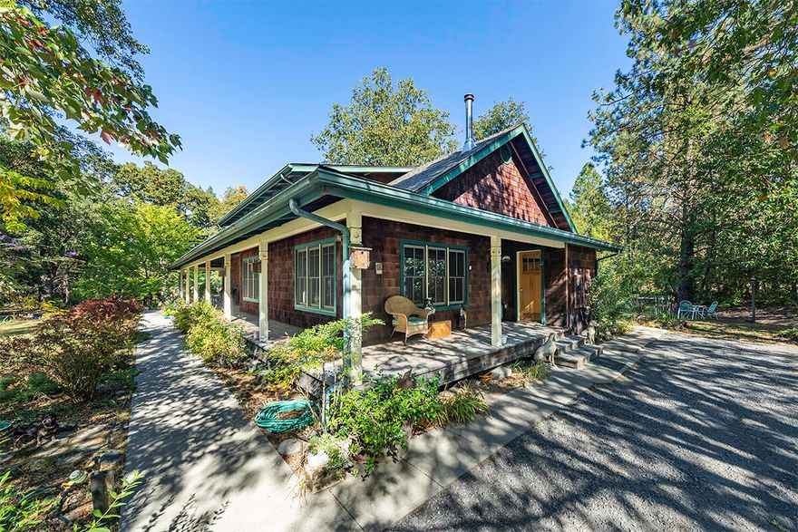 Tucked away from the busy world on 77.63 acres sits this estate with trails & pastures, meadows, 5 ponds, and forest nooks providing ferns, shade trees and evergreens along with creek frontage. Fully equipped with an 8 stall ''Mare Motel'' matted & covered, with cross fencing & runs, as well as a dog kennel.  There's 4560 sq ft barn, with two attached workshops and a spacious studio apartment, a wildlife viewing copula and covered storage for hay and equipment. Near the main house you'll find an oversized detached garage with extra space that can function as an office or art/yoga studio. Enter the inviting 2993 sqft custom built craftsman style home boasting 3 very spacious bedrooms with the Primary Bedroom on the main floor and 2.5 bathrooms. The comfortable study provides tongue and groove wood finishes and built-in shelving. Upstairs you'll find two additional bedrooms, along with two covered decks to view the wildlife, ponds & pastures in all seasons.