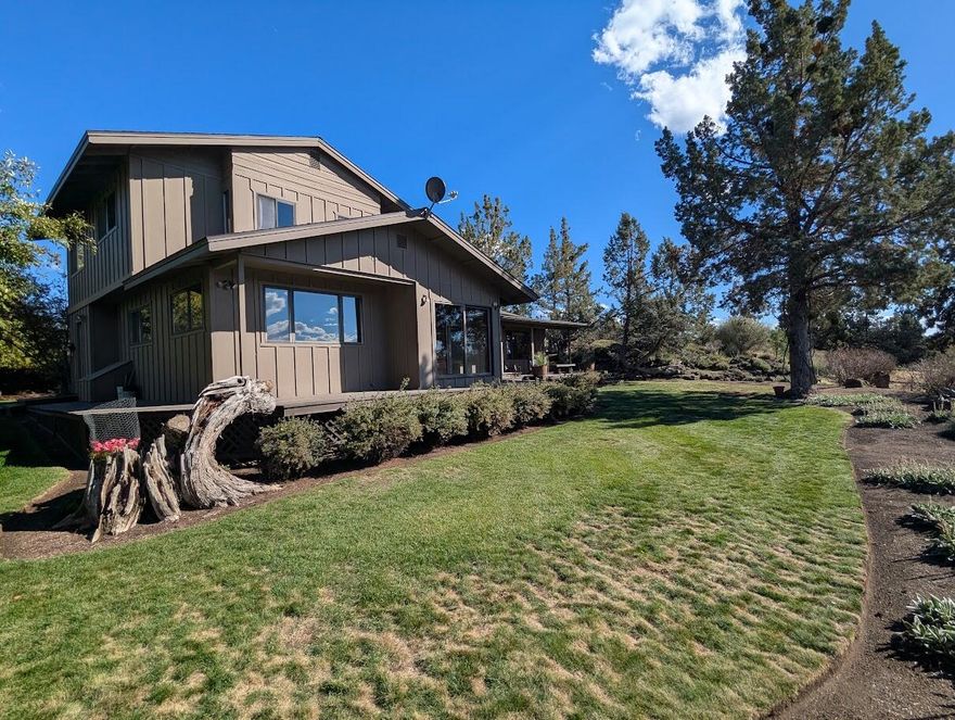 Find your peace in Tumalo. Set on just over 9 acres a quiet country lifestyle just a short drive from Bend. Enjoy stunning Cascade Mountain & pastoral views from the covered deck, the perfect spot to unwind. Inside, this one owner home has great bones, featuring beautiful original 6'' clear fir plank floors throughout the main level. The kitchen includes those same fir floors plus a charming antique wood cook stove alongside the appliances you expect. The primary bedroom is conveniently located on the main level, with two more bedrooms upstairs. The carpets have already been removed, so you can choose new flooring that fits your style. Outside, you'll find a workshop/storage area above the cistern, a wood storage building with attached chicken coop, fenced pasture, pond & riding arena. With 5.88 acres of Swalley irrigation rights, there's plenty of water for your land, animals or garden.