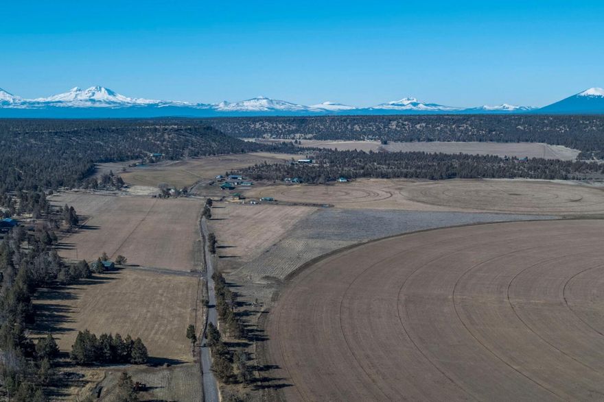 A unique opportunity to own 32.57 ac. of land in beautiful Lower Bridge. This expansive parcel offers 32.57 acres of pressurized Three Sisters Irrigation water (1895 water rts), perfect for farming or pasture for your animals. Enjoy the convenience of power ready at the road and easy gravel access, making this land very accessible. The property boasts breathtaking territorial views of rolling pastures, lush farmland, and majestic buttes, providing an idyllic backdrop for agricultural projects. Partially fenced for privacy. Don't miss out on this chance to secure such a stunning piece of Oregon's landscape. Book a viewing today and explore the potentials this property has to offer! Buyer or Buyers Agent to do their due diligence.