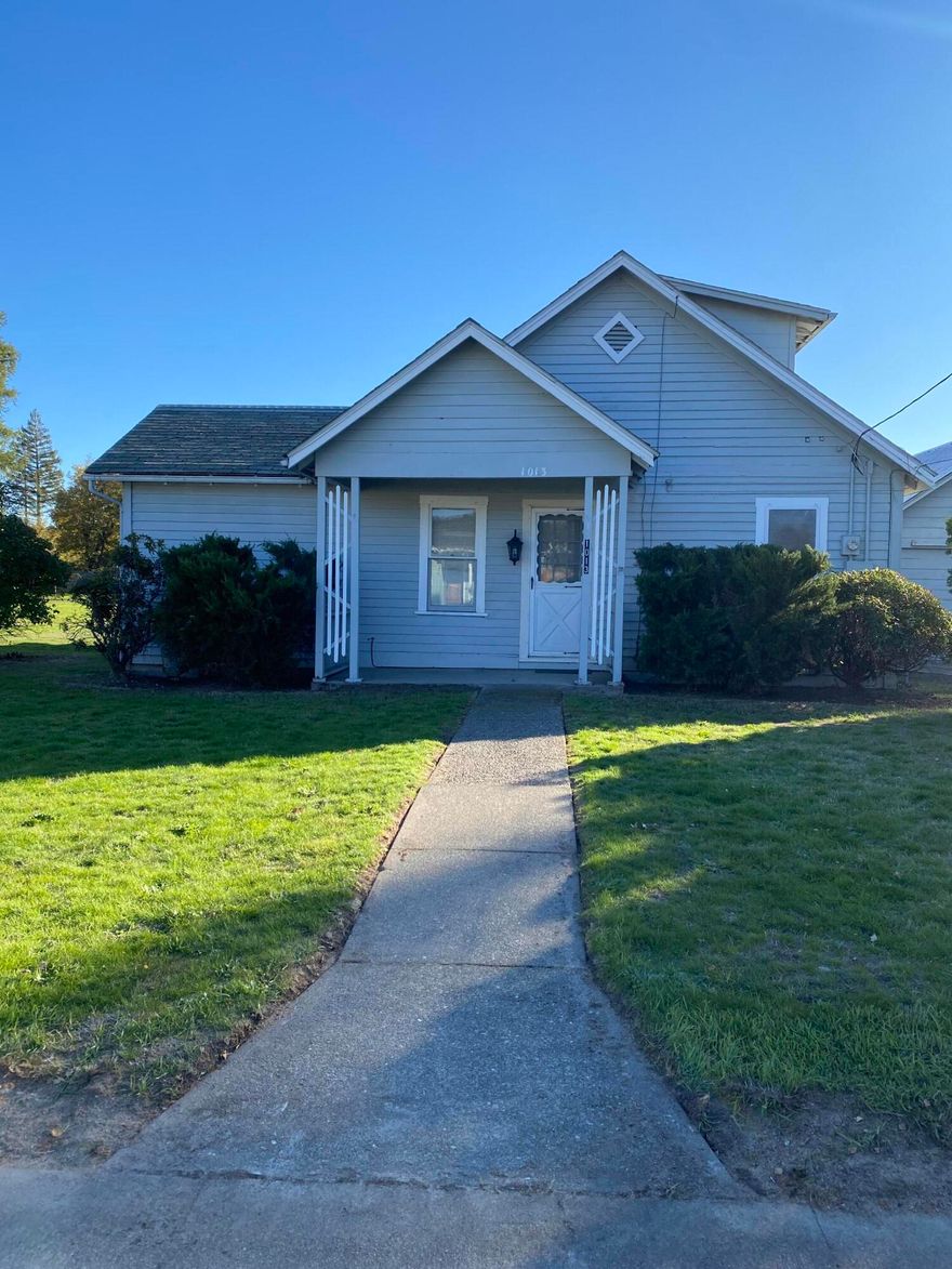 This charming two-bedroom, one-bath home offers comfort, functionality, and plenty of space for projects or hobbies. With 1,288 square feet of living area, the main level features a spacious front living room, a bright kitchen with breakfast nook, and a covered patio that opens to the backyard—perfect for relaxing or entertaining. A laundry room and large pantry add convenience, while the mudroom entry provides everyday practicality. Upstairs, you'll find a second bedroom and a bonus room for extra living space or storage.

Outside, the property includes ample off-street parking and a detached two-car garage with a large workshop—ideal for tools, toys, or creative projects. Recent updates include new flooring on the main level and plumbing improvements.

Located in southwest Grants Pass, the home offers easy access to dining, shopping, and Interstate onramps for a smooth commute while maintaining a comfortable residential setting.