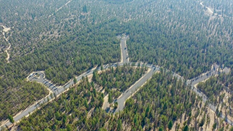 Nestled just outside La Pine, Oregon, this stunning lot offers the opportunity to build your dream home in the coveted Wagon Trail Ranch community. Enjoy a wealth of amenities including a clubhouse, heated swimming pool, saunas, expansive common areas, horse corral, and direct access to the picturesque Little Deschutes River—ideal for fishing, rafting, and kayaking. With an abundance of recreational activities right at your doorstep, from hiking and skiing to snowmobiling, you'll never run out of ways to enjoy the breathtaking beauty of Central Oregon. Whether you're seeking a peaceful retreat or a vibrant, active lifestyle, this is the perfect place to call home.  Lot 15 has 1.60 acres