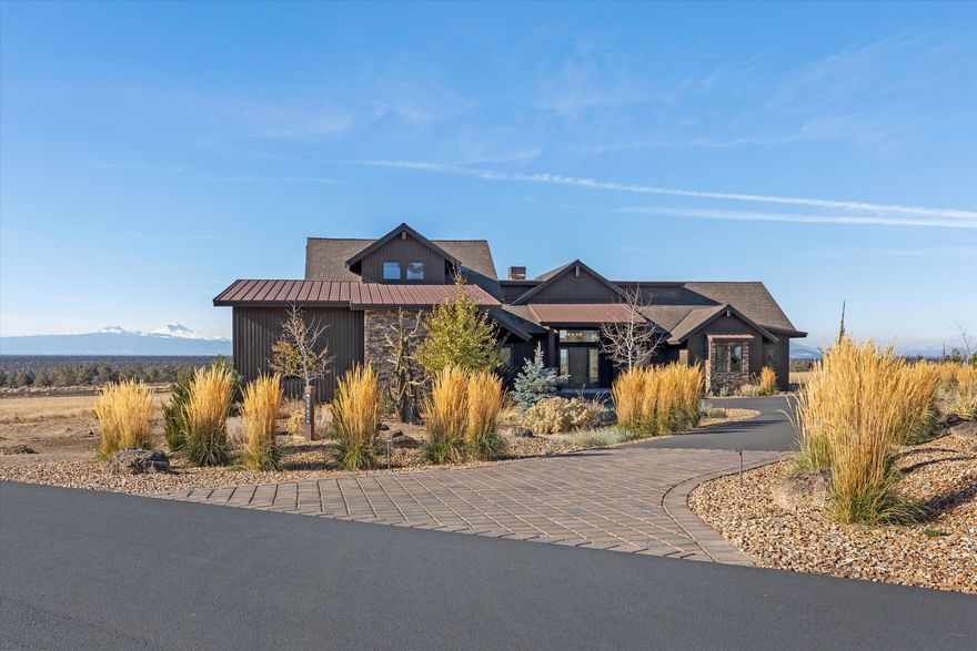 Stunning NW Style 3BD/4.5BA home with bonus room, office, and RV garage perfectly captures the architectural flavor of Brasada Ranch. You are greeted with panoramic views of the Cascade Mountains from the large windows in the great room that features a custom rock & steel fireplace w/ a reclaimed wood mantle. Extensive beam work with nearly 30' of vaulted ceilings. This open plan flows to the kitchen/dining area with custom cabinetry, high efficiency appliances, Subzero column fridge & more. Looking west from the large kitchen island, the fully stackable doors create a beautifully placed view corridor that captures The Three Sisters from both the kitchen & dining area. Beyond the doors is a large patio with an outdoor kitchen & gas fire pit to take in Brasada's sunsets. The primary bedroom is positioned to offer expansive mountain views while blending a rustic warmth that flows into the radiant heated floors of the primary bathroom. All bedrooms are ensuite and feature walk-in closets.