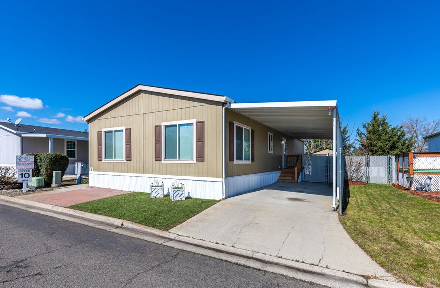 Adorable move-in ready home in a quiet park tucked into SW Medford. You would never know you're just a few minutes away from restaurants and shopping like Trader Joe's when you drive into this neighborhood. Meadow View Estates is charming all-ages
park that's very peaceful and well maintained. The home has had only one owner since it was purchased in 2014 and is ready for its new family! The lot is fully fenced and backs up to an open space for plenty of privacy, and the patio makes it feel like your own little oasis. Everything about this home and park says 'Welcome home.'