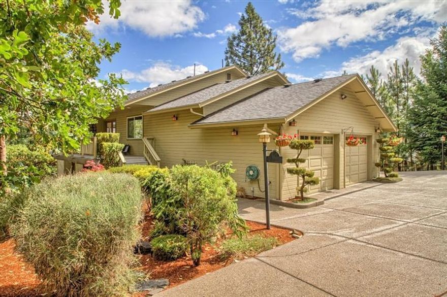 Located in a serene setting with sweeping panoramic views, this 3184.SF Ashland home offers an open floor plan, 3 bedrooms, 2.5 bath, numerous custom touches and thoughtful amenities. The kitchen is a chef's dream with a six burner Decor range/oven (propane), granite counter tops, bakers counter/butcher block, custom made cabinets & hardware, a trash compactor, birch flooring. The large great room has a FP (propane), surround sound. The formal dining room features alder wood built in China Cabinet and buffet. The oversized master bedroom offers a wood burning FP and a Jacuzzi tub in bathroom, extensive decks. 2 New Water Heaters installed, HVAC Serviced, New Blower fan in 1st floor unit. Windows are covered with a solar film covering on the East & West side of house. Outside speaker systems on upper deck with glass shielding to take advantage of the views, exposed aggregate/concrete driveway and much more. One of the Owners is a Real Estate Broker licensed in the State of Oregon