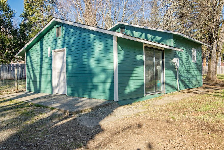 Discover the hidden potential of this charming cottage, perfectly positioned just outside of town on nearly an acre. This delightful two-bedroom, one-bathroom home has undergone recent updates, featuring a brand-new roof and a freshly painted exterior. This fully fenced property is uniquely equipped with two separate septic systems, two wells, and a permit secured for a second dwelling, making it an ideal candidate for a two-family setup or a potential investment opportunity. The spacious detached garage provides ample room for storage or hobbies, adding to the overall utility of the property. Embrace the tranquility of country living while enjoying the convenience of being only a short 10-minute drive from the heart of town.