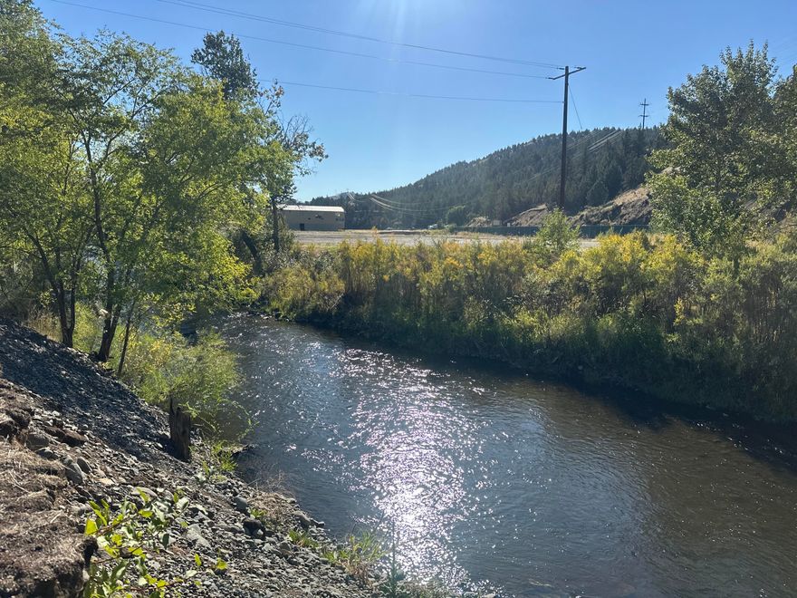 Riverfront Commercial Property for Sale Discover an exceptional opportunity to own riverfront commercial property in the charming city of John Day, Oregon. This prime location offers 2.8 acres of potential, two tax lots. Purchase one or both to suit your business needs ($95,000 individually)Within city limits of John Day, Oregon, This land is zoned General Industrial with a Retail Sales and Commercial Services overlay, making it an ideal spot for an RV park or other exciting ventures. With its strategic location and zoning flexibility, the possibilities are endless. Out of the Flood Plain: Safe and secure investment.  3-phase power, water, and sewer available at the property line. New paved city street, sidewalk, approach, and curb installed for easy access. Adjacent to scenic walking trails along the river leading to community parks and walkable access to downtown. Enjoy beautiful views and direct access to nature.  Future growth opportunity. Purchase lots separately for $95,000 each