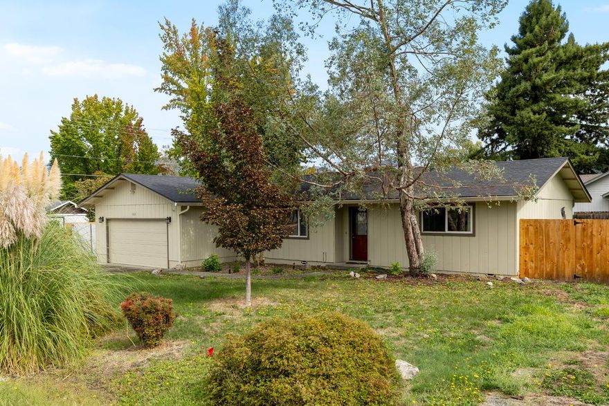 Calling all car enthusiasts & hobbyists! This 1,557 sq ft, 3-bd, 2-bath home on a large .23-acre corner lot is engineered for your passion, with a 2-car garage PLUS a separate insulated 1-car garage with lift, complemented by expansive concrete parking that accommodates 6+ vehicles, RV, or boat storage. Prime location in the county but on city services offer quick access to hospitals, shopping, & proximity to the Cathedral Hills trail system. The smart split-floorplan layout features a spacious primary en suite with vaulted ceilings, walk-in closet & a convenient slider to a covered deck overlooking the fenced backyard. Primary bathroom has both a travertine walk-in shower & large jetted soaker tub, and double vanity. You will find quality finishes such as knotty alder soft-close cabinetry w/ pull-outs, gas furnace/central air, & modern appliances. Guest bath features double vanity. Dining area slider opens to concrete patio for outdoor living & entertainment. This is a wonderful home