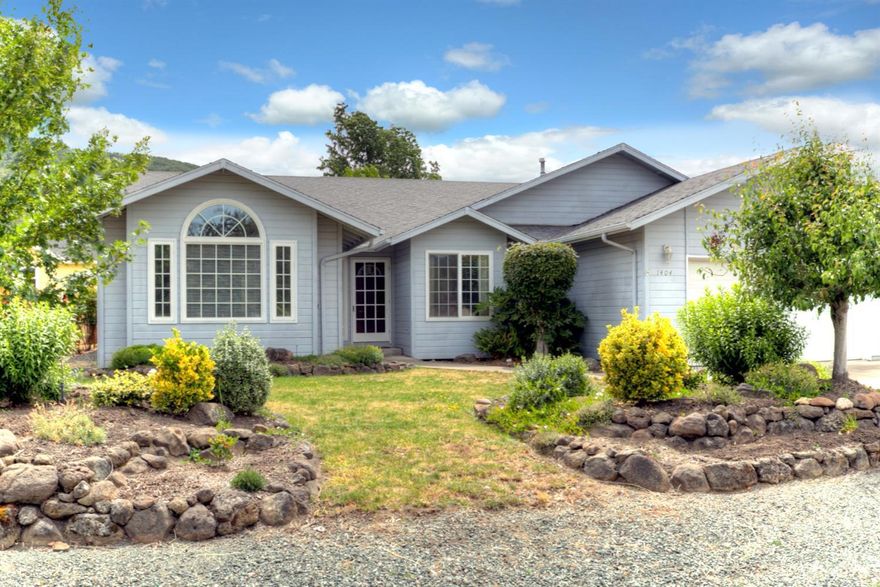 Nice home in the sought after town of Talent. Beautiful hardwood flooring throughout! Vaulted ceiling in the living room, spacious master suite with a walk-in closet and a door leading to the back deck. Kitchen has an island, breakfast nook and a dining area. Peaceful quiet neighborhood with nice views, RV Parking, a sunny spot for a garden, and a terrific backyard with a water feature & deck for entertaining!