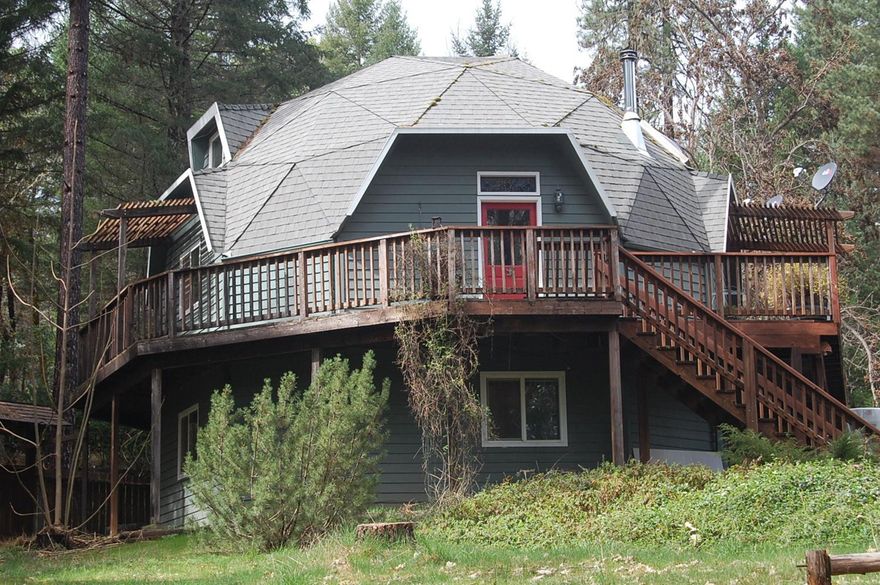 This special place is just outside of town and offers easy access to part of the wild and scenic area of the Rogue River. The home is located among tall trees offering privacy and enjoyment of the local wildlife. You'll find beautiful areas for your gardens, there's a garden/potting shed, play house and gazebo overlooking the pond with a waterfall feature. Are you familiar with dome homes?... per Dome Incorporated, The dome's shape and inherent structural integrity make it both stronger and more energy-efficient than a typical family home (noted on CBS Money Watch 2/15/14).