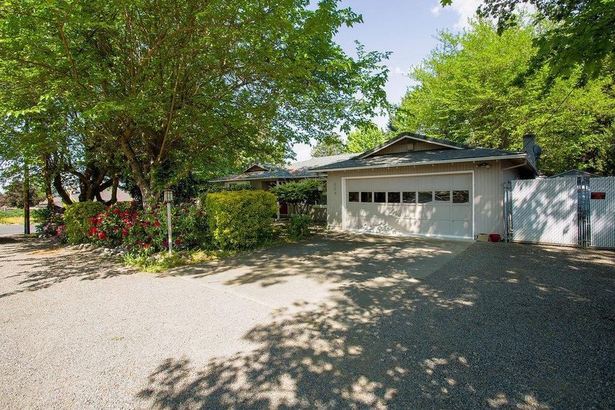 Contemporary touches in a park-like setting. Wide plank laminate flooring. Large and bright kitchen looks out onto backyard. Newer counter tops, stainless appliances, and terra cotta tile floor. Spacious and inviting living room with picture window and great light. Warm family room features a fireplace with has insert and plenty of entertainment space. Spacious bedrooms. Updated en-suite master bath. Covered patio perfect for extended season outdoor living space. Enjoy the mature trees and landscaping in the private feeling yard. RV Parking.