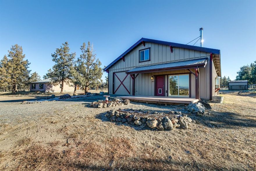 Beautiful & serene property in the area of Tumalo with easy access to Bend, Sisters or Redmond. This 160 degree view property is a 26.48 acre ranch with 24 acres of water rights with main irrigation canal running through the property. Totally fenced with underground sprinklers in upper field , a pond , wheel line and hay barn in the lower 18 acres. The pole barn has a permitted 2 bedroom, 1.5 bath apt, 2 horse stalls, two 12 ft barn doors with garage door openers for quick drive through and even a hay loft. With permanent CUP in place for remodeling/demolishing the original homestead and rebuilding your new home. Property has private well with cistern, underground power lines and a newer septic system. The main home is non livable and is being used as a storage building only. This is a gorgeous piece of property in the heart of Tumalo. Call a REALTOR for your showing today!!