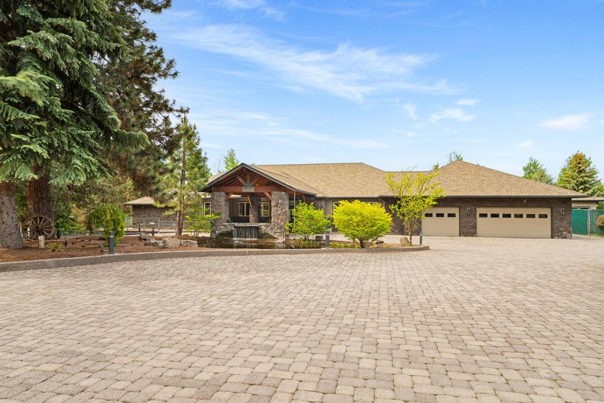 Seller is highly motivated! Make an offer! Welcome to a luxurious Central Oregon gated estate spanning 25.36 +/- acres, featuring an artesian irrigation well, 21.92 +/- irrigated acres and stunning views! Located in Bend, this exceptional property offers a custom 8,300 + sq. ft. main residence with 5 bedrooms, including two main-level primary suites, a gourmet kitchen, game room, office, workout facility and an indoor pool. The equestrian facilities include a barn, 6 paddocks and inground irrigated pastures. Additional amenities include a 2-bedroom bunkhouse, 7-bay workshop/garage, pickleball/tennis court, 3 ponds, dog kennel and an expansive deck overlooking the property and the Cascade Mountains. This rare estate combines luxurious living with functionality, making it perfect for those seeking a blend of elegance, space, and a connection to nature. Whether you're looking for privacy, or simply enjoying the beauty of Central Oregon, this beautiful property has everything you need.