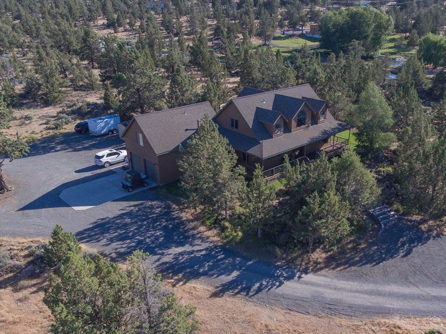 Stunning home w/acreage bordering COI main canal! Water views when irrig. is running. Perfect setting for privacy! Conveniently located between Bend and Redmond makes this home on 4.8 acres the place to see! Home features spacious kitchen with island, great room w/fireplace, 4 bedrooms (2 master suites) 1 master suite w/ separate entrance from main house, large utility room, Covered porches, inground sprinkler system. Detached 1200 sq ft shop w/ office and bathroom. AWESOME Property! MOTIVATED seller!