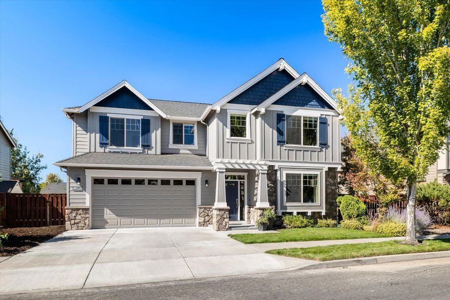 Experience elevated living in this award-winning Pahlisch Homes design, located in the highly sought-after Fieldstone Crossing neighborhood in NW Redmond! This 2,633 sq ft home offers 4 bedrooms and 3 baths. The main living area features an open floor plan with 18' ceilings, walls of windows, a stone gas fireplace, and solid hickory hardwood floors. The chef's kitchen includes a dual-fuel gas range, walk-in pantry, dining area, and adjacent full bath. Upstairs, the primary suite showcases Cascade Mountain views, double vanities, soaking tub, shower, enclosed water closet, and walk-in closet. Two additional bedrooms, a spacious bonus/media room, full bath with dual vanities, and laundry complete the upper level. The landscaped backyard features a tranquil fountain and outdoor barbecue area, perfect for entertaining. The double car garage offers finished walls, epoxy floors, and generous storage. A bordering common area and trail enhance backyard privacy and charm.